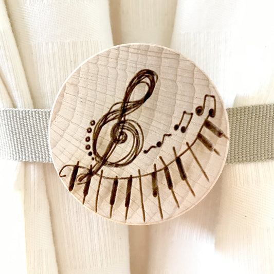 Curtain magnet. Made of solid beech wood with musical note decoration. Original handmade gift for all those who love to decorate their home.
