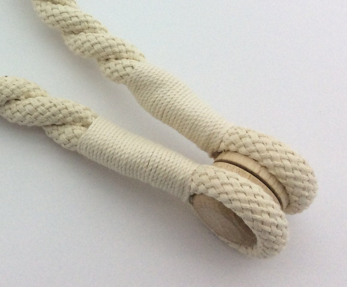 Cotton. A 16mm magnetic curtain tie-back, 75cm long. Rustic, nautical, and shabby chic style, neutral for any decor.