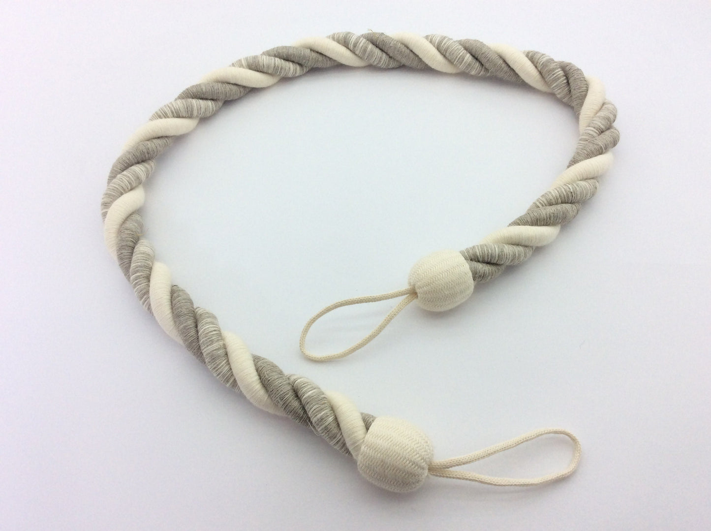 Linen and Cotton. A natural rope curtain tie-back, 25mm thick and 80cm long. Rustic, nautical, and shabby chic style, neutral for any decor.